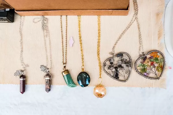 Various necklaces on white surface