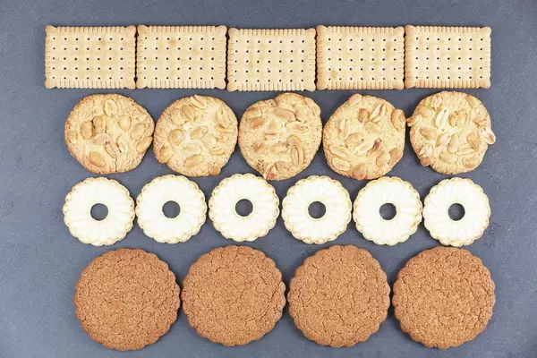 Various shapes of biscuits, dark background (Flip 2019)