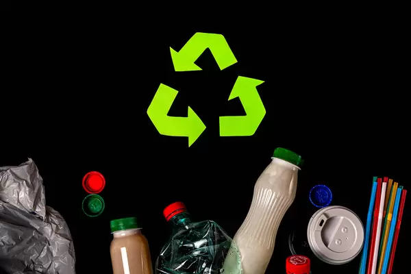 Various types of garbage and recycle sign on black