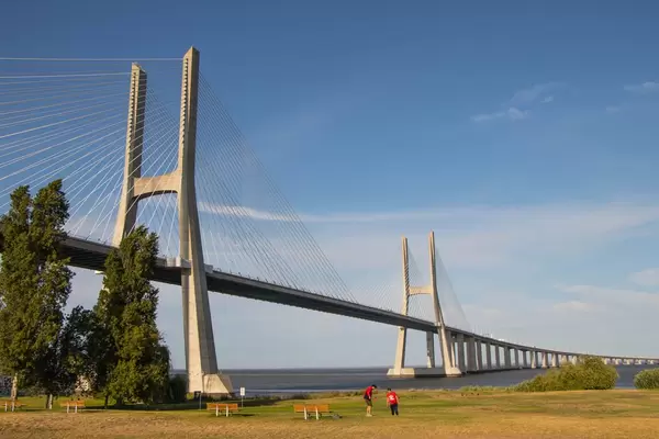 Vasco da Gama Bridge and park with blue sky