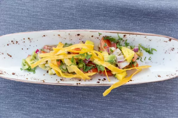 Vegan Mexican food: ceviche salad with mango, avocado, tomato, sweet chili & coriander vinaigrette