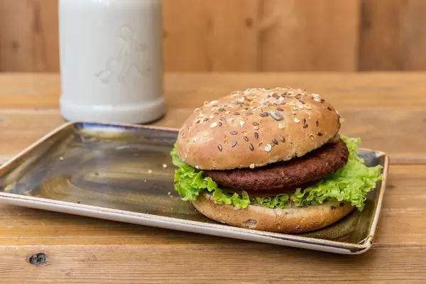 Vegan "Naturbursche" burger by Moving Mountains with a vegetable patty made of beetroot juice, coconut, mushrooms, peas, wheat- & soy proteins