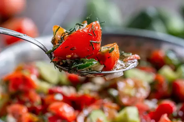 Vegetable salad in a spoon, close-up
