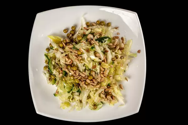 Vegetable salad with sunflower seeds, top view