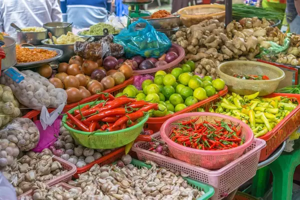 Vegetable Vendor at a Local Food Market in Saigon