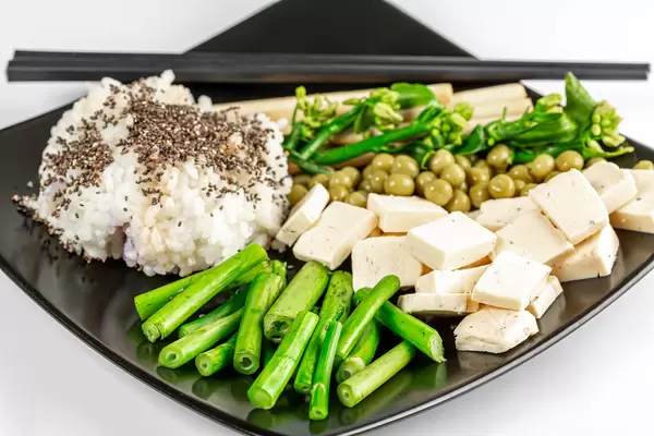 Vegetarian lunch - rice, peas, broccolini with cheese and chia seeds