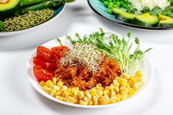 Vegetarian lunch with stewed cabbage, vegetables and micro greenery