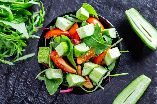 Vegetarian salad with tomatoes, cucumbers and herbs (Flip 2019)