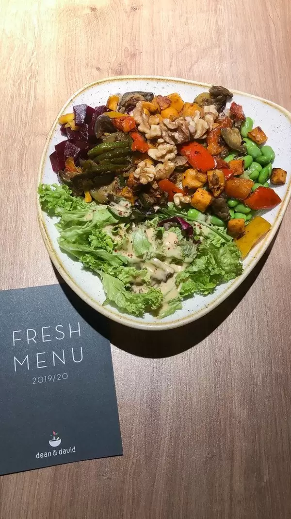 Veggie Bowl with grilled vegetables, Edamame, nuts, eggplants, basil, wholemeal rice & soy sesame sauce, next to a Fresh Menu Card
