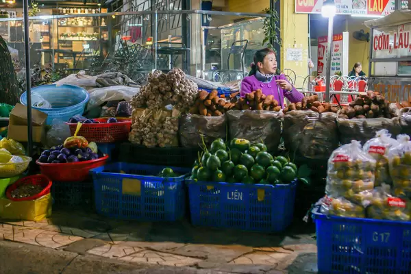 Vendor selling many kinds of Fruits and Vegetables at a Street Market in Dalat, Vietnam