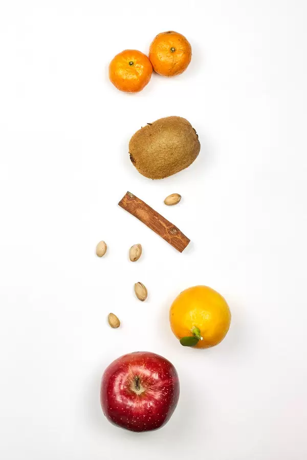 Vertically arranged fruits on white