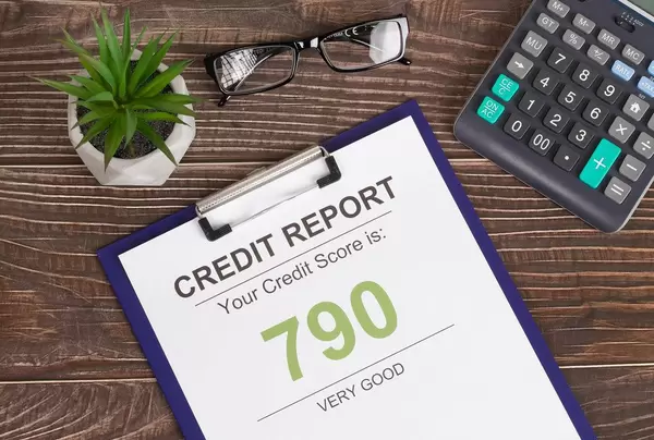 Very good credit score report of 790 on wooden desk