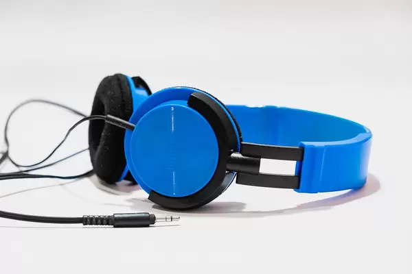 Vibrant blue headphones on white background (Flip 2019)
