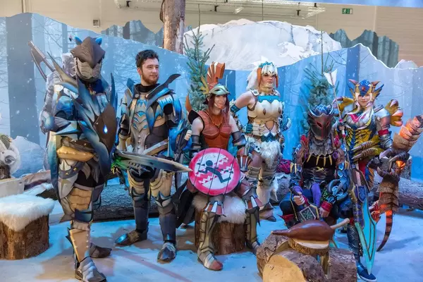 Video gamers in cosplay costumes in the ice landscape of Monster Hunter World: Iceborne