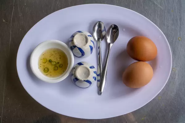 Vietnamese Creamy Boiled Egg - Trung Ga La Cot on a Plate with Fish Sauce
