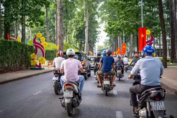 Vietnamese Flags and Tet Decorations along a Street in Saigon, Vietnam