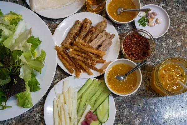 Vietnamese Grilled Pork Sausauge with different kinds of Herbs, Vegetables and Rice Paper