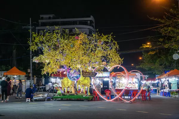 Vietnamese New Year of the Ox Decorations with Hearts and Peach Blossom Tree at Son Tra Night Market in the City Center of Da Nang, Vietnam