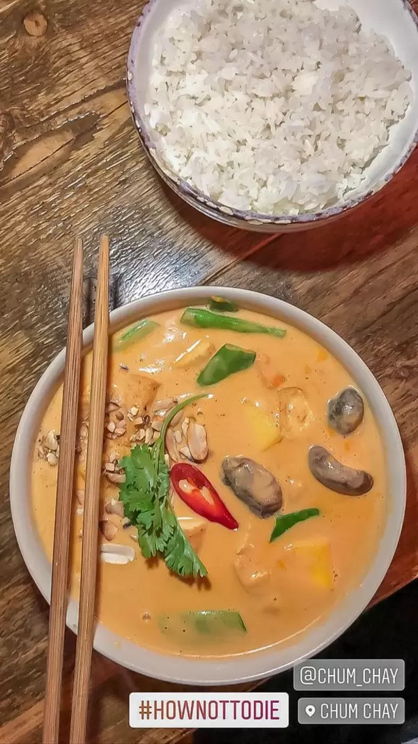 View from above of spicy chum chay, tofu in coconut curry with mango and rice with hashtag hownottodie