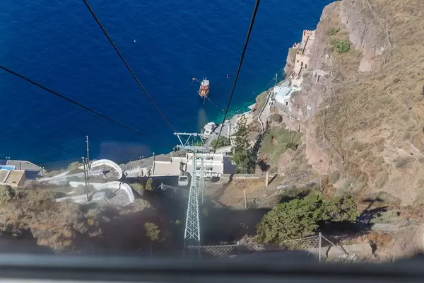View from the cable car looking down towards the old port and the deep blue Aegean Sea in Santorini