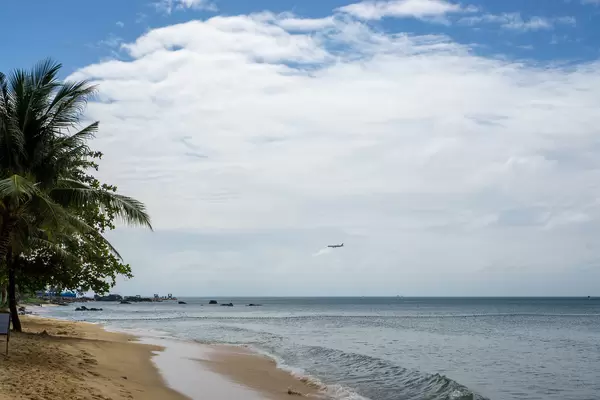 View of a Plane landing at Phu Quoc International Airport from the Beach at Istanbul Beach Club on Phu Quoc Island, Vietnam