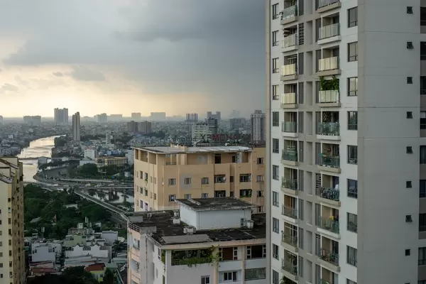 View of Ho Chi Minh City from an Apartment Building at Sunset with Rain Clouds over the City