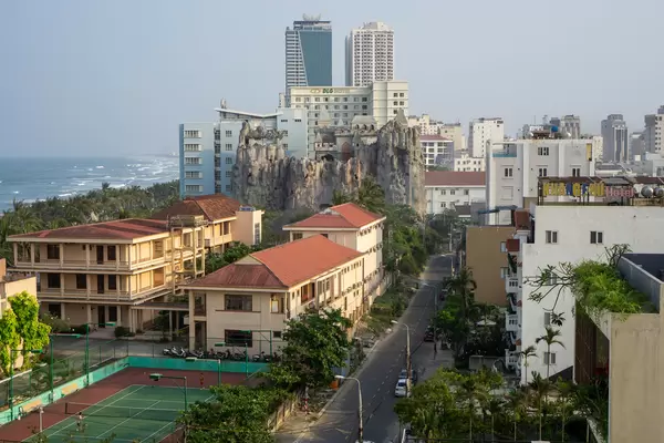 View of My Khe Beach, Tennis Court, Buildings and a Castle on top of a Large Rock in Da Nang, Vietnam