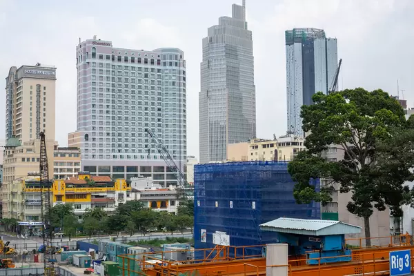 View of Nguyen Hue Walking Street, Caravelle Hotel, Sheraton and the Construction of Hilton Hotel Saigon in Ho Chi Minh City, Vietnam