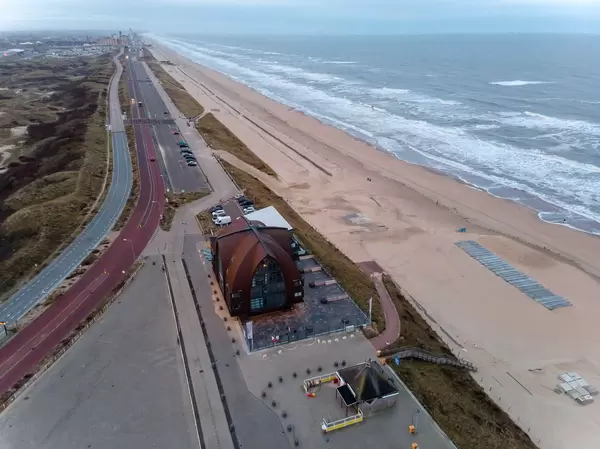 View of the coastal road in Bloemendaal with beach, sea and beach hotel