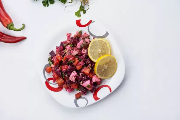 Vinegret salad with diced cooked vegetables, chopped onions, sauerkraut, and brined pickles