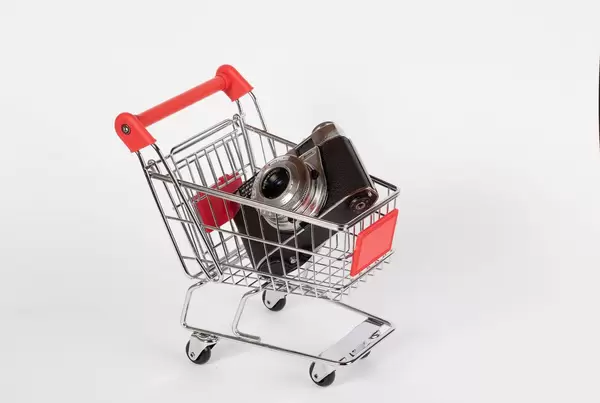 Vintage camera in shopping cart