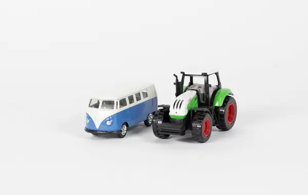 Vintage camper van and green tractor