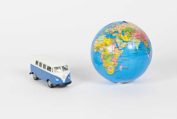 Vintage camper van with globe