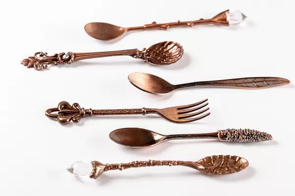Vintage tea spoons and fork on a white background