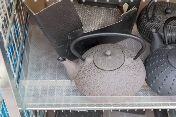 Vintage teapots made of cast iron at Naschmarkt in Vienna