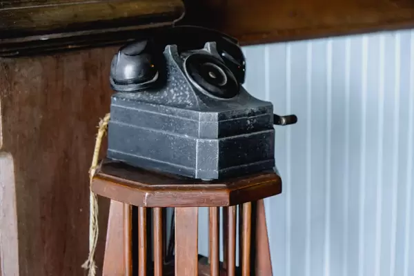 Vintage telephone on wooden stool