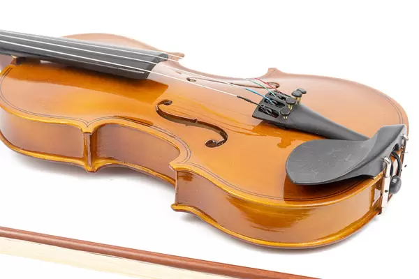 Violin with Fiddle Bow isolated above white background