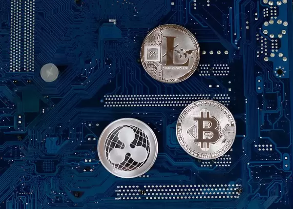 Virtual symbols of the coin Bitcoin, Litecoin and Ripple