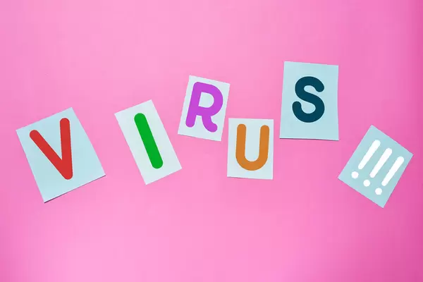 Virus word made with magazine letter paper cuts