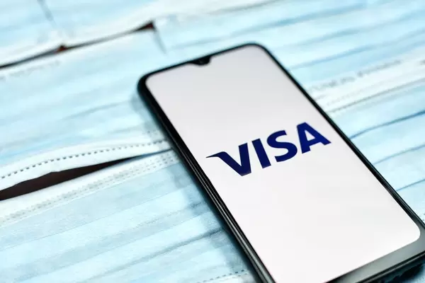 Visa logo on phone screen. Covid-19 effect on company business