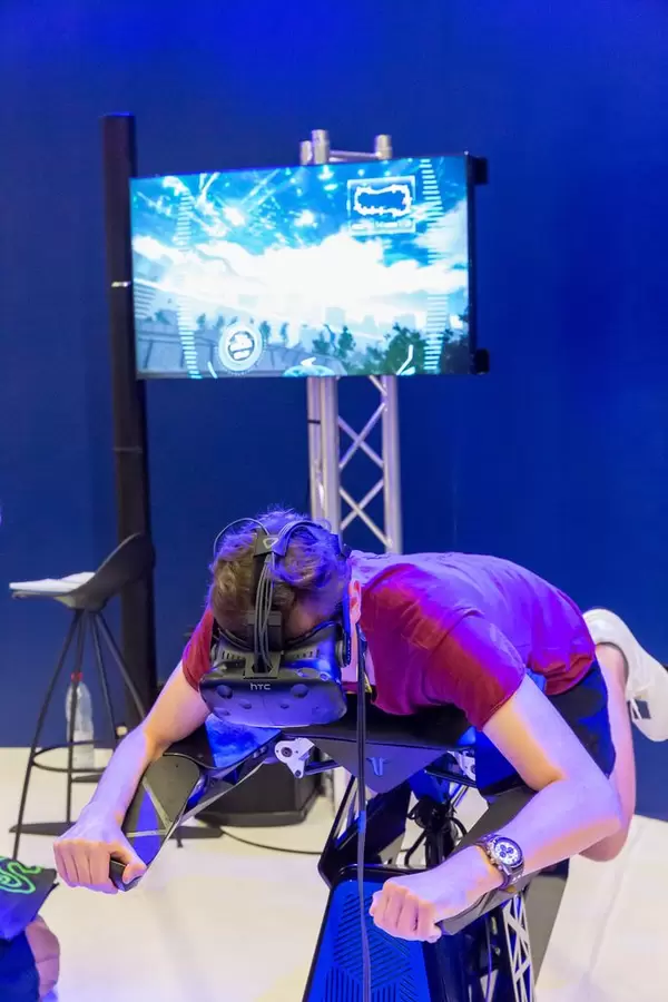 Visitor trying out VR flight simulation at Airbus booth