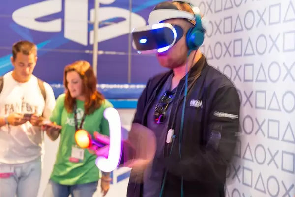 Visitor waving about the PlayStation Move controllers (PS4 VR) - Gamescom 2017, Cologne