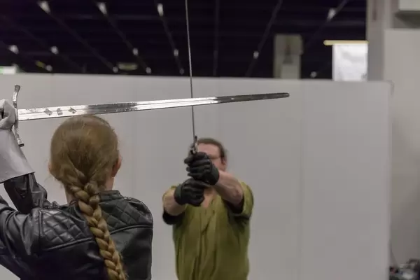 Visitors fighting with LARP swords