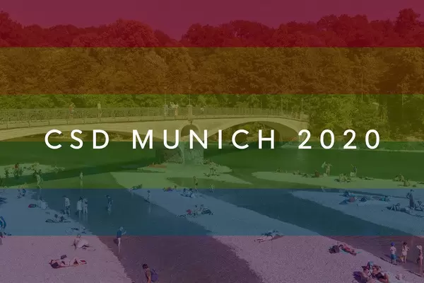 Visitors on the banks of Isar River next to Mariannenbrücke bridge near Praterinsel a Rainbowflag & picture title CSD Munich 2020