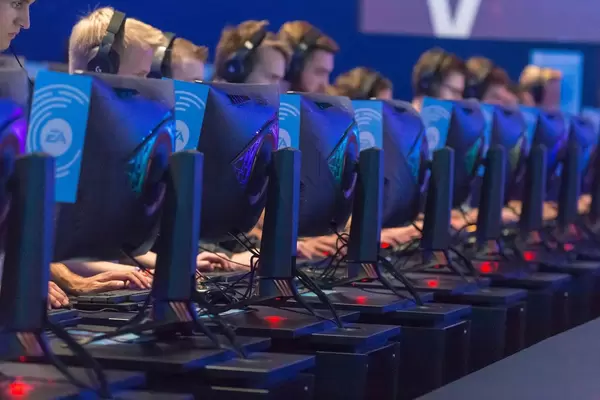 Visitors playing Battlefield V on EA gaming rigs