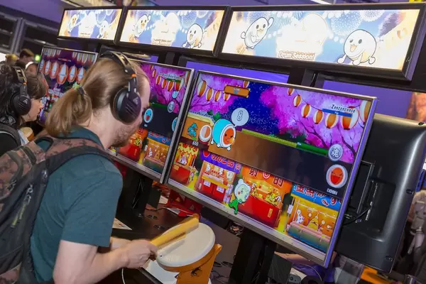 Visitors playing Taiko Drum Master Nintendo Switch