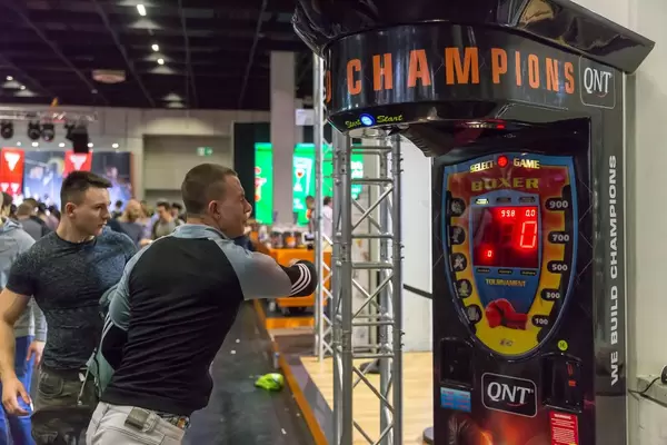 Visitors punching a boxing machine - FIBO Cologne 2018