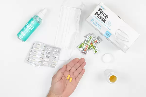 Vitamin Pills and Covid virus protection alcohol and face masks
