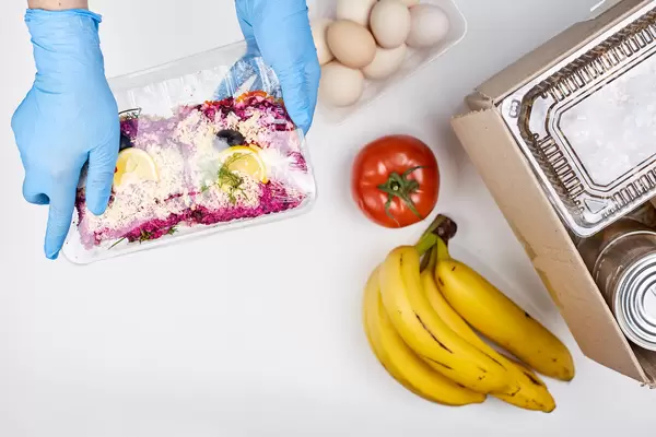 volunteer distributing food to poor and homeless