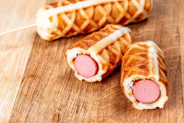 Waffle sausages on a wooden kitchen board (Flip 2020)